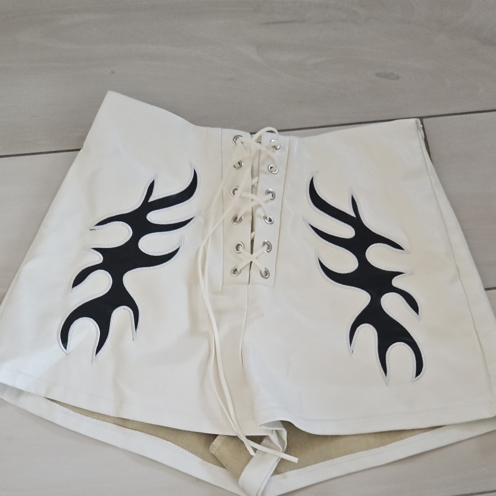 12th Tribe White Lace-Up High Waist Shorts with Black Flame Design